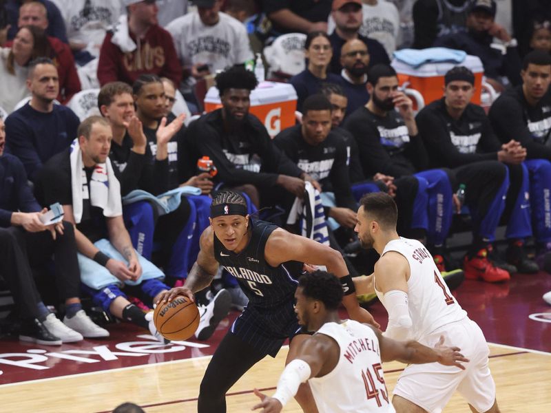 CLEVELAND, OH - APRIL 22: Paolo Banchero #5 of the Orlando Magic dribbles the ball during the game against the Cleveland Cavaliers during Round 1 Game 2 of the 2024 NBA Playoffs on April 22, 2024 at Rocket Mortgage FieldHouse in Cleveland, Ohio. NOTE TO USER: User expressly acknowledges and agrees that, by downloading and/or using this Photograph, user is consenting to the terms and conditions of the Getty Images License Agreement. Mandatory Copyright Notice: Copyright 2024 NBAE (Photo by Lauren Leigh Bacho/NBAE via Getty Images)