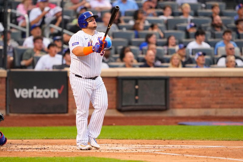 Aug 30, 2023; New York City, New York, USA;  New York Mets designated hitter Daniel Vogelbach (32) watches his home run against the Texas Rangers during the second inning at Citi Field. Mandatory Credit: Gregory Fisher-USA TODAY Sports