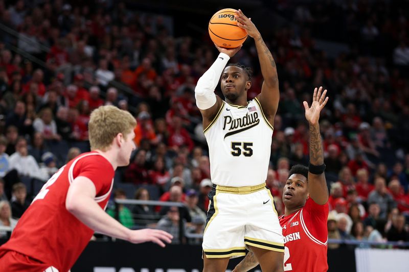 Mar 16, 2024; Minneapolis, MN, USA; Purdue Boilermakers guard Lance Jones (55) shoots as Wisconsin Badgers guard AJ Storr (2) defends during the first half at Target Center. Mandatory Credit: Matt Krohn-USA TODAY Sports