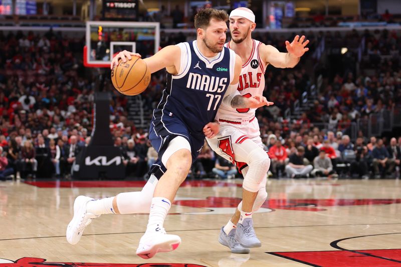 CHICAGO, ILLINOIS - MARCH 11: Luka Doncic #77 of the Dallas Mavericks drives to the basket against Alex Caruso #6 of the Chicago Bulls during the first half at the United Center on March 11, 2024 in Chicago, Illinois. NOTE TO USER: User expressly acknowledges and agrees that, by downloading and or using this photograph, User is consenting to the terms and conditions of the Getty Images License Agreement.  (Photo by Michael Reaves/Getty Images)