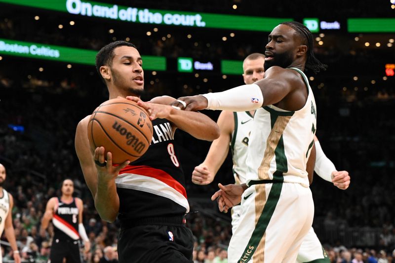 BOSTON, MASSACHUSETTS - APRIL 07: Jaylen Brown #7 of the Boston Celtics defends Kris Murray #8 of the Portland Trail Blazers during the second quarter at the TD Garden on April 07, 2024 in Boston, Massachusetts. NOTE TO USER: User expressly acknowledges and agrees that, by downloading and or using this photograph, User is consenting to the terms and conditions of the Getty Images License Agreement. (Photo by Brian Fluharty/Getty Images)