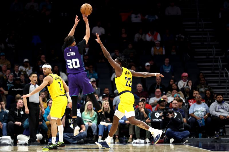 CHARLOTTE, NORTH CAROLINA - FEBRUARY 12: Seth Curry #30 of the Charlotte Hornets shoots the ball over .p23 during the second half of an NBA game at Spectrum Center on February 12, 2024 in Charlotte, North Carolina. NOTE TO USER: User expressly acknowledges and agrees that, by downloading and or using this photograph, User is consenting to the terms and conditions of the Getty Images License Agreement. (Photo by David Jensen/Getty Images)