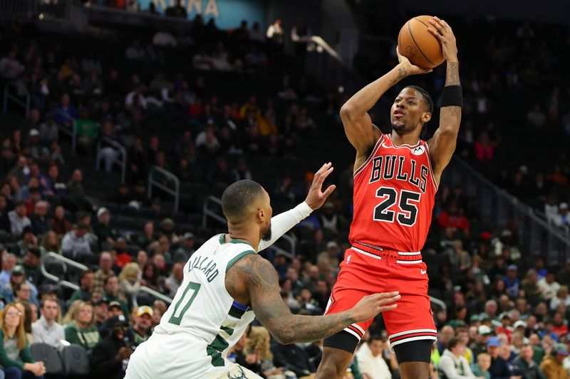 MILWAUKEE, WISCONSIN - OCTOBER 14: Jalen Smith #25 of the Chicago Bulls shoots over Damian Lillard #0 of the Milwaukee Bucks during the first half of a preseasongame at Fiserv Forum on October 14, 2024 in Milwaukee, Wisconsin.  NOTE TO USER: User expressly acknowledges and agrees that, by downloading and or using this photograph, User is consenting to the terms and conditions of the Getty Images License Agreement. (Photo by Stacy Revere/Getty Images)