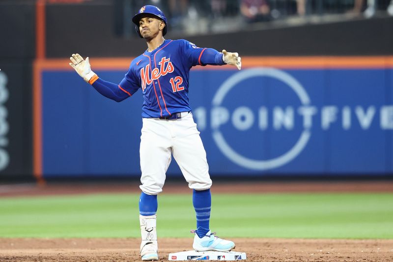 Jun 26, 2024; New York City, New York, USA;  New York Mets shortstop Francisco Lindor (12) celebrates after hitting a double in the third inning against the New York Yankees at Citi Field. Mandatory Credit: Wendell Cruz-USA TODAY Sports