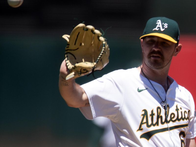 Jun 23, 2024; Oakland, California, USA; Oakland Athletics starting pitcher Hogan Harris (63) gets a new baseball after allowing a solo home run to Minnesota Twins center fielder Byron Buxton (not pictured) during the second inning at Oakland-Alameda County Coliseum. Mandatory Credit: D. Ross Cameron-USA TODAY Sports