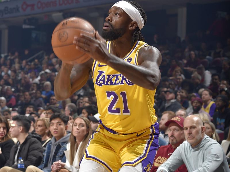 CLEVELAND, OH - DECEMBER 6: Patrick Beverly #21 of the Los Angeles Lakers shoots a three point basket during the game against the Cleveland Cavaliers on December 6, 2022 at Rocket Mortgage FieldHouse in Cleveland, Ohio. NOTE TO USER: User expressly acknowledges and agrees that, by downloading and/or using this Photograph, user is consenting to the terms and conditions of the Getty Images License Agreement. Mandatory Copyright Notice: Copyright 2022 NBAE (Photo by David Liam Kyle/NBAE via Getty Images)