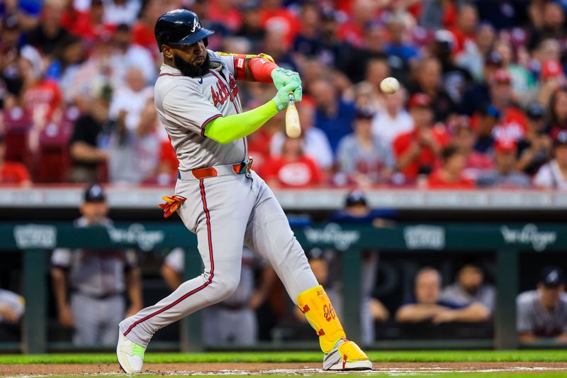 Sep 17, 2024; Cincinnati, Ohio, USA; Atlanta Braves designated hitter Marcell Ozuna (20) hits a single against the Cincinnati Reds in the first inning at Great American Ball Park. Mandatory Credit: Katie Stratman-Imagn Images