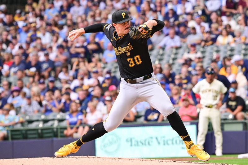 Jul 11, 2024; Milwaukee, Wisconsin, USA; Pittsburgh Pirates starting pitcher Paul Skenes (30) pitches in the first inning against the Milwaukee Brewers at American Family Field. Mandatory Credit: Benny Sieu-USA TODAY Sports