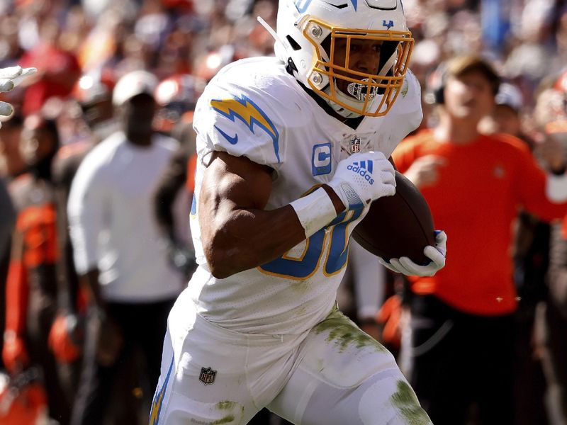 Los Angeles Chargers running back Austin Ekeler (30) runs with the ball during an NFL football game against the Cleveland Browns, Sunday, Oct. 9, 2022, in Cleveland. (AP Photo/Kirk Irwin)