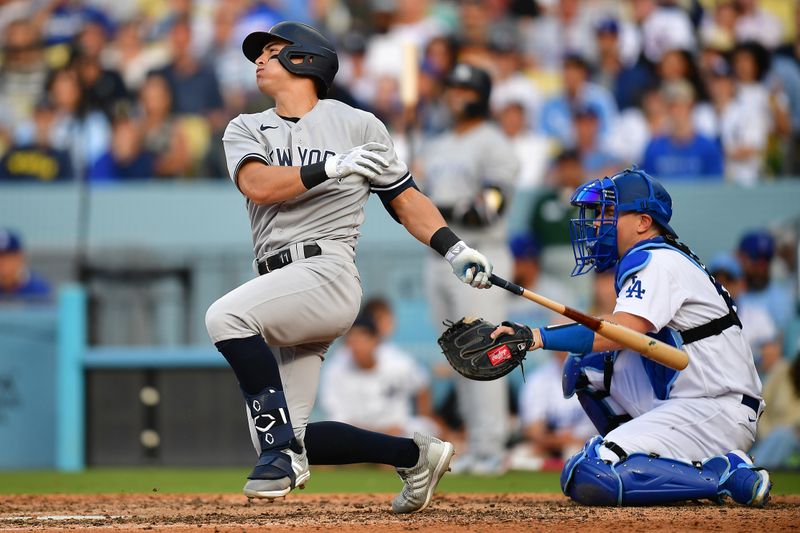 Jun 4, 2023; Los Angeles, California, USA; New York Yankees shortstop Anthony Volpe (11) hits a two run home run against the Los Angeles Dodgers during the ninth inning at Dodger Stadium. Mandatory Credit: Gary A. Vasquez-USA TODAY Sports