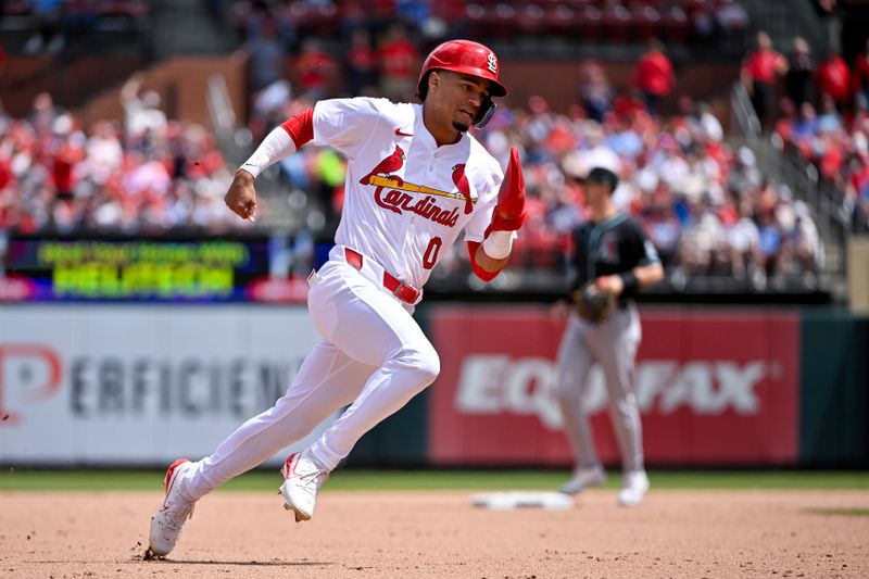 Apr 24, 2024; St. Louis, Missouri, USA;  St. Louis Cardinals shortstop Masyn Winn (0) runs and scores against the Arizona Diamondbacks during the seventh inning at Busch Stadium. Mandatory Credit: Jeff Curry-USA TODAY Sports