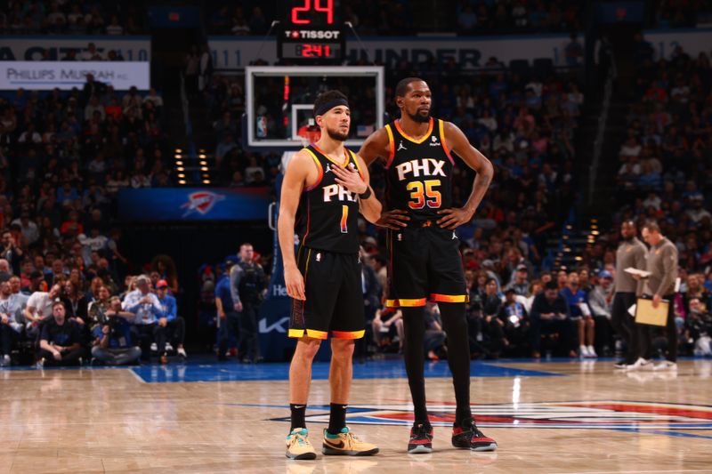 OKLAHOMA CITY, OK - MARCH 29: Devin Booker #1 talks to Kevin Durant #35 of the Phoenix Suns during the game against the Oklahoma City Thunder on March 29, 2024 at Paycom Arena in Oklahoma City, Oklahoma. NOTE TO USER: User expressly acknowledges and agrees that, by downloading and or using this photograph, User is consenting to the terms and conditions of the Getty Images License Agreement. Mandatory Copyright Notice: Copyright 2024 NBAE (Photo by Zach Beeker/NBAE via Getty Images)