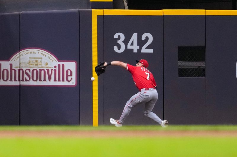 Sep 27, 2025; Milwaukee, Wisconsin, USA;  Cincinnati Reds left fielder Gavin Lux (2) is unable to catch the fly ball hit by Milwaukee Brewers second baseman Brice Turang (2) (not pictured) during the third inning at American Family Field. Mandatory Credit: Jeff Hanisch-Imagn Images