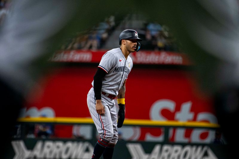 Sep 3, 2023; Arlington, Texas, USA; Minnesota Twins shortstop Carlos Correa (4) leads off from second base during the fourth inning against the Texas Rangers at Globe Life Field. Mandatory Credit: Jerome Miron-USA TODAY Sports