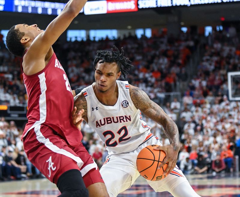 Feb 11, 2023; Auburn, Alabama, USA;  Auburn Tigers guard Allen Flanigan (22) drives into Alabama Crimson Tide forward Nimari Burnett (25) at Neville Arena. Mandatory Credit: Julie Bennett-USA TODAY Sports

