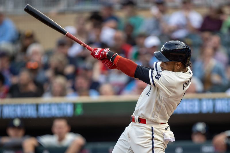 May 10, 2023; Minneapolis, Minnesota, USA; Minnesota Twins second baseman Jorge Polanco (11) hits a double in the second inning against the San Diego Padres at Target Field. Mandatory Credit: Jesse Johnson-USA TODAY Sports