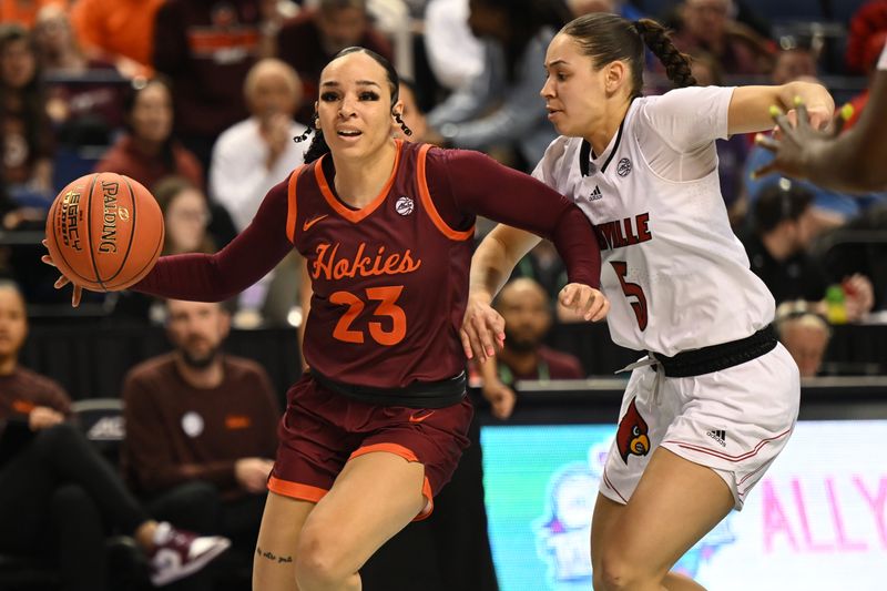 Mar 5, 2023; Greensboro, NC, USA; Virginia Tech Hokies guard Kayana Traylor (23) dribbles past Louisville Cardinals guard Mykasa Robinson (5) during the second half at Greensboro Coliseum. Mandatory Credit: William Howard-USA TODAY Sports