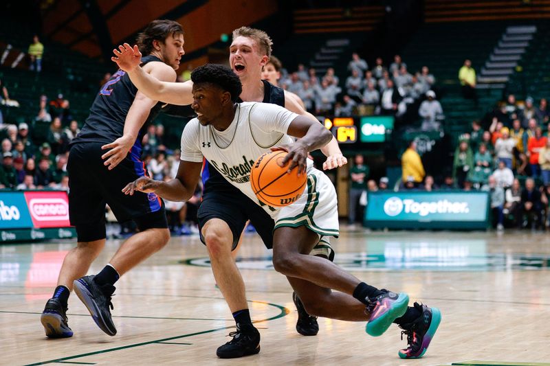 Feb 15, 2023; Fort Collins, Colorado, USA; Colorado State Rams guard Isaiah Stevens (4) drives to the net against Boise State Broncos guard Jace Whiting (15) in the second half at Moby Arena. Mandatory Credit: Isaiah J. Downing-USA TODAY Sports