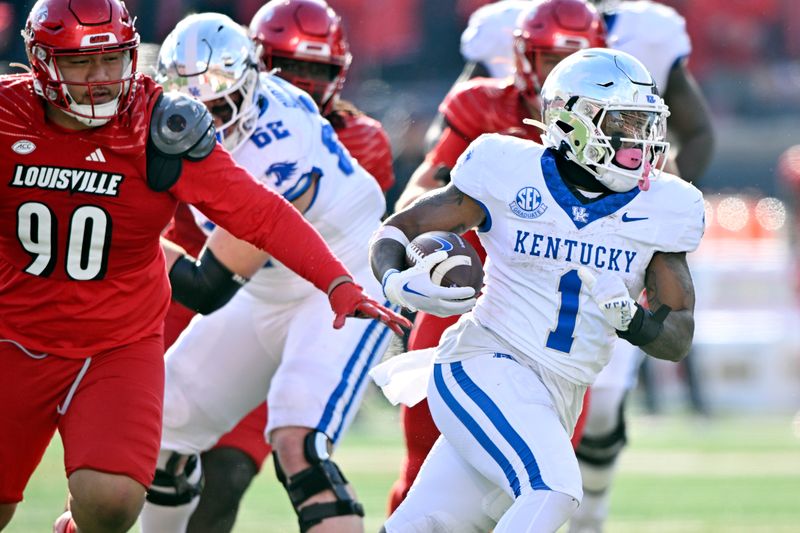 Nov 25, 2023; Louisville, Kentucky, USA;  Kentucky Wildcats running back Ray Davis (1) runs the ball against Louisville Cardinals defensive lineman Jermayne Lole (90) during the second half at L&N Federal Credit Union Stadium. Kentucky defeated Louisville 38-31. Mandatory Credit: Jamie Rhodes-USA TODAY Sports