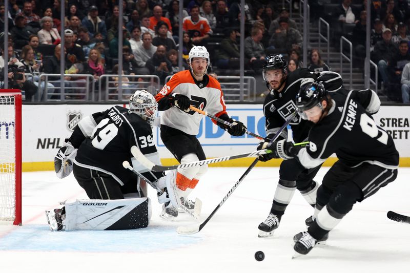 Nov 11, 2023; Los Angeles, California, USA;  Philadelphia Flyers left wing Joel Farabee (86) looks as Los Angeles Kings center Adrian Kempe (9) chases the puck during the third period at Crypto.com Arena. Mandatory Credit: Kiyoshi Mio-USA TODAY Sports