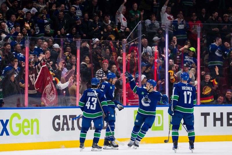 Dec 14, 2023; Vancouver, British Columbia, CAN; Vancouver Canucks defenseman Quinn Hughes (43) and forward Dakota Joshua (81) and forward Teddy Blueger (53) and defenseman Filip Hronek (17) celebrate Joshua   s second goal of the game against the Florida Panthers in the second period at Rogers Arena. Vancouver won 4-0. Mandatory Credit: Bob Frid-USA TODAY Sports