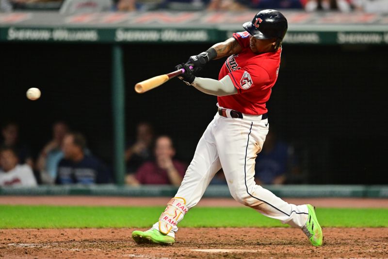 Sep 5, 2023; Cleveland, Ohio, USA; Cleveland Guardians third baseman Jose Ramirez (11) hits a single during the sixth inning against the Minnesota Twins at Progressive Field. Mandatory Credit: Ken Blaze-USA TODAY Sports