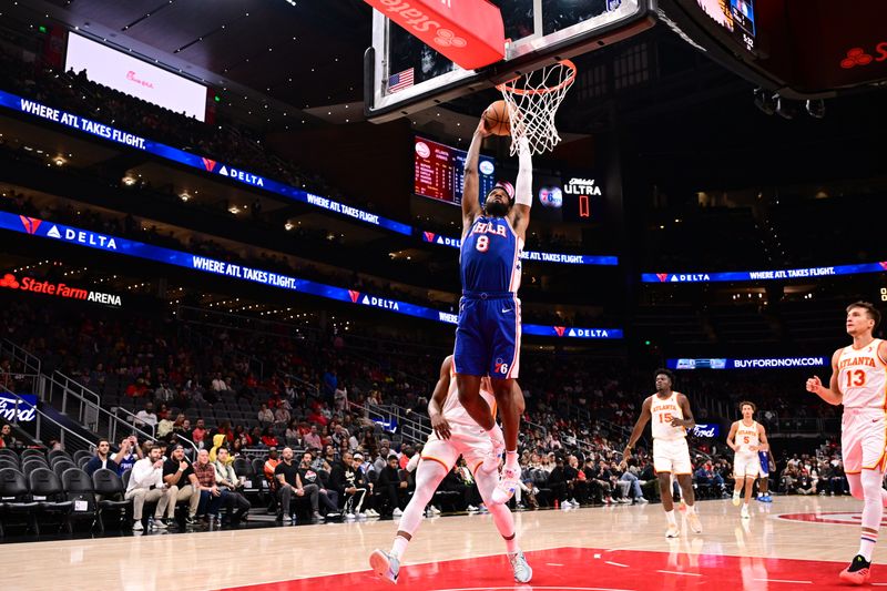 ATLANTA, GA - OCTOBER 14: Paul George #8 of the Philadelphia 76ers dunks the ball during the game against the Atlanta Hawks  during a preseason game on October 14, 2024 at State Farm Arena in Atlanta, Georgia.  NOTE TO USER: User expressly acknowledges and agrees that, by downloading and/or using this Photograph, user is consenting to the terms and conditions of the Getty Images License Agreement. Mandatory Copyright Notice: Copyright 2024 NBAE (Photo by Adam Hagy/NBAE via Getty Images)