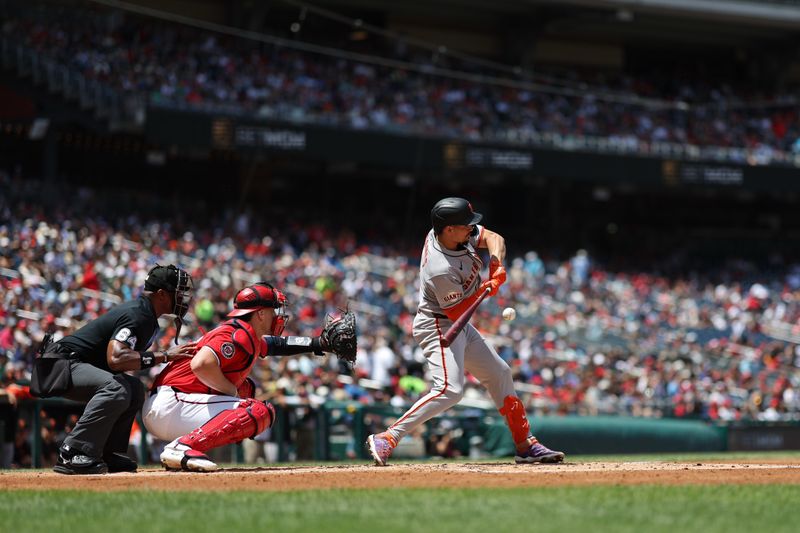 May 25, 2025; Washington, District of Columbia, USA; San Francisco Giants shortstop Willy Adames (2) hits a groundout RBI against the Washington Nationals during the second inning at Nationals Park. Mandatory Credit: Geoff Burke-Imagn Images