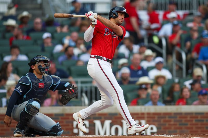 Jun 14, 2024; Atlanta, Georgia, USA; Atlanta Braves first baseman Matt Olson (28) hits a double against the Tampa Bay Rays in the first inning at Truist Park. Mandatory Credit: Brett Davis-USA TODAY Sports
