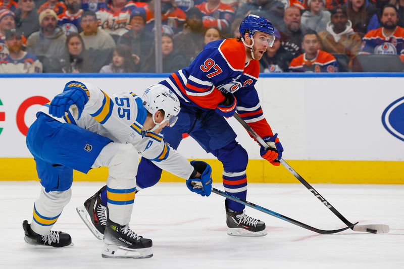 Jan 18, 2026; Edmonton, Alberta, CAN; St. Louis Blues defensemen Colton Parayko (55) defends Edmonton Oilers forward Connor McDavid (97) during the first period at Rogers Place. Mandatory Credit: Perry Nelson-Imagn Images