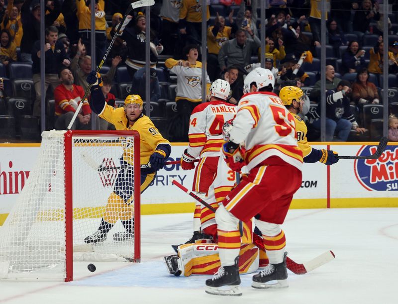 Nov 1, 2025; Nashville, Tennessee, USA; Nashville Predators center Jonathan Marchessault (81) celebrates a Predators goal scored against the Calgary Flames during the first period at Bridgestone Arena. Mandatory Credit: Alan Poizner-Imagn Images