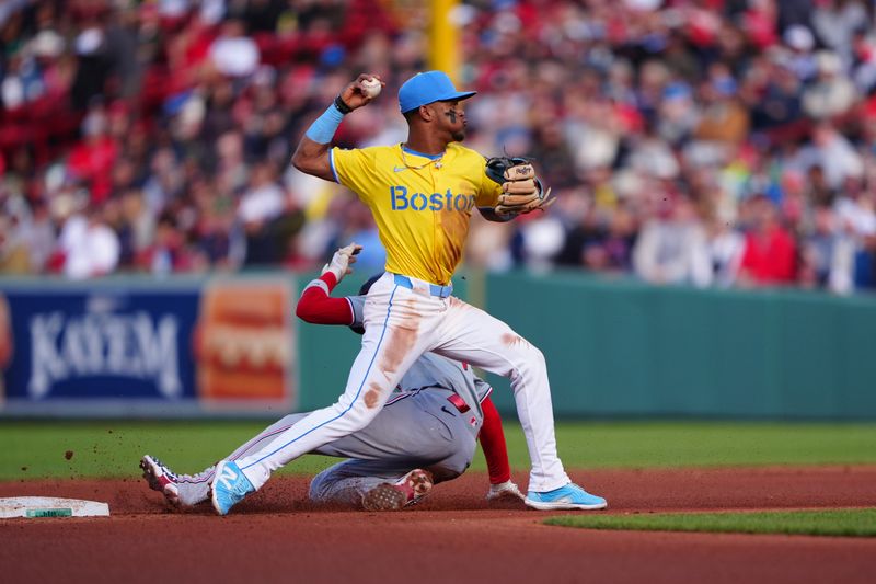 May 11, 2024; Boston, Massachusetts, USA; Boston Red Sox shortstop Ceddanne Rafaela (43) turns a double play during the sixth inning against the Washington Nationals at Fenway Park. Mandatory Credit: Gregory Fisher-USA TODAY Sports