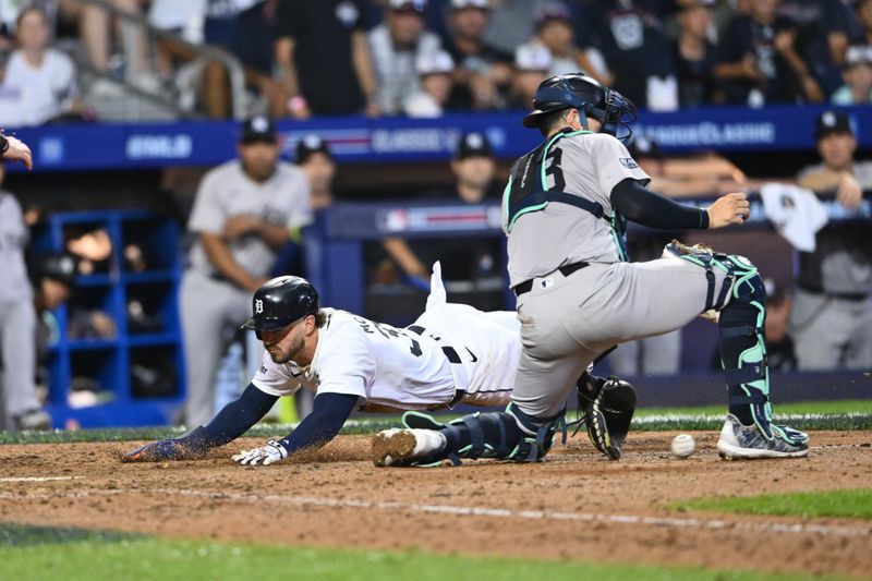 Aug 18, 2024; Williamsport, Pennsylvania, USA; Detroit Tigers infielder Zach McKinstry (39) slides home to score against New York Yankees catcher Austin Wells (28) in the tenth inning at BB&T Ballpark at Historic Bowman Field. Mandatory Credit: Kyle Ross-USA TODAY Sports