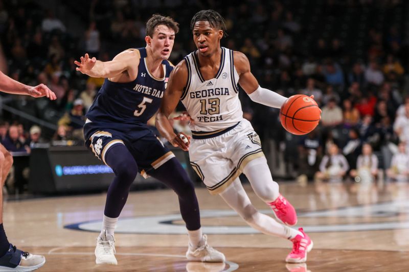 Feb 8, 2023; Atlanta, Georgia, USA; Georgia Tech Yellow Jackets guard Miles Kelly (13) is defended by Notre Dame Fighting Irish guard Cormac Ryan (5) in the second half at McCamish Pavilion. Mandatory Credit: Brett Davis-USA TODAY Sports