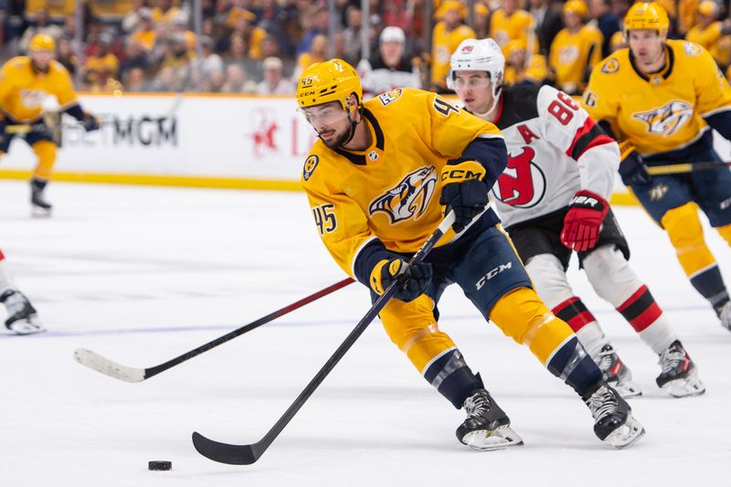 Feb 13, 2024; Nashville, Tennessee, USA;  Nashville Predators defenseman Alexandre Carrier (45) skates against the New Jersey Devils during the second period at Bridgestone Arena. Mandatory Credit: Steve Roberts-USA TODAY Sports