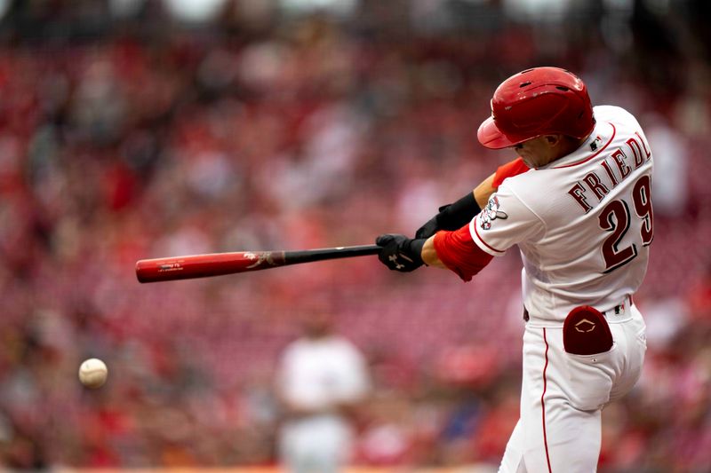 Sep 6, 2023; Cincinnati, Ohio, USA; Cincinnati Reds center fielder TJ Friedl (29) hits a triple in the first inning of the MLB baseball game between the Cincinnati Reds and the Seattle Mariners at Great American Ball Park. Mandatory Credit: Albert Cesare-USA TODAY Sports