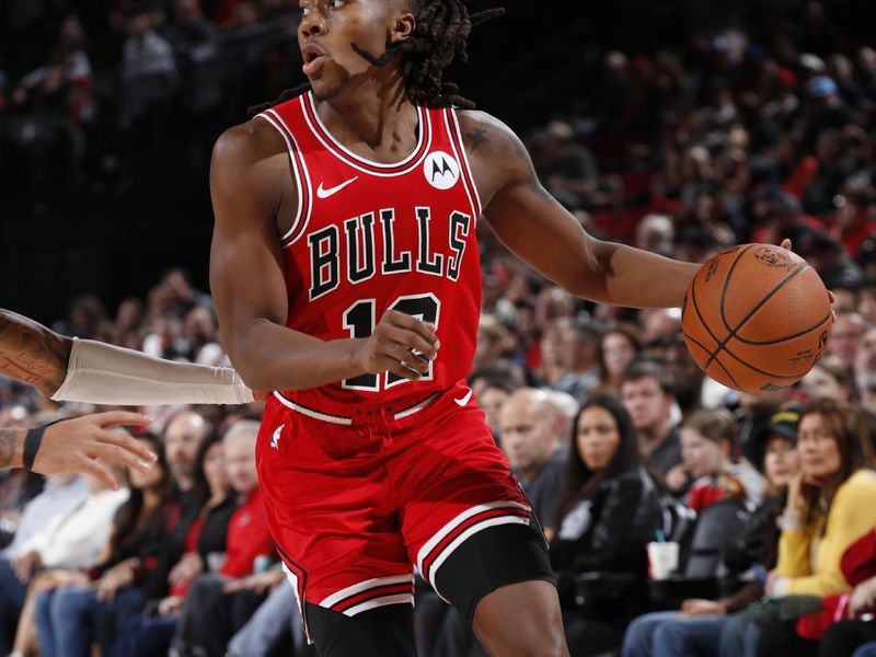 PORTLAND, OR - JANUARY 28: Ayo Dosunmu #12 of the Chicago Bulls handles the ball during the game against the Portland Trail Blazers on January 28, 2024 at the Moda Center Arena in Portland, Oregon. NOTE TO USER: User expressly acknowledges and agrees that, by downloading and or using this photograph, user is consenting to the terms and conditions of the Getty Images License Agreement. Mandatory Copyright Notice: Copyright 2024 NBAE (Photo by Cameron Browne/NBAE via Getty Images)