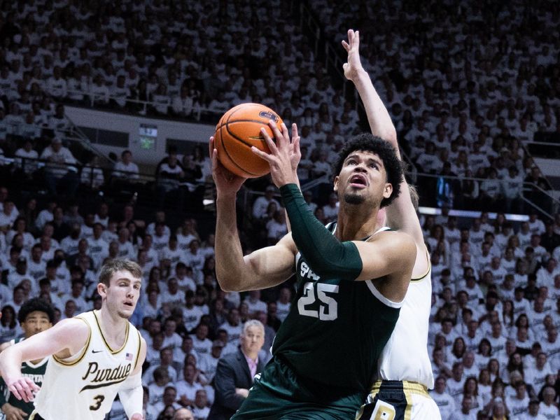 Jan 29, 2023; West Lafayette, Indiana, USA; Michigan State Spartans forward Malik Hall (25) shoots the ball while Purdue Boilermakers guard Fletcher Loyer (2) defends in the first half at Mackey Arena. Mandatory Credit: Trevor Ruszkowski-USA TODAY Sports