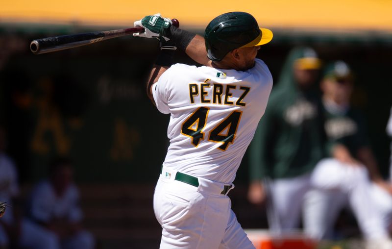 Sep 6, 2023; Oakland, California, USA; Oakland Athletics catcher Carlos P  rez (44) hits a two run home run against Toronto Blue Jays starting pitcher Hyun Jin Ryu during the fourth inning at Oakland-Alameda County Coliseum. Mandatory Credit: D. Ross Cameron-USA TODAY Sports