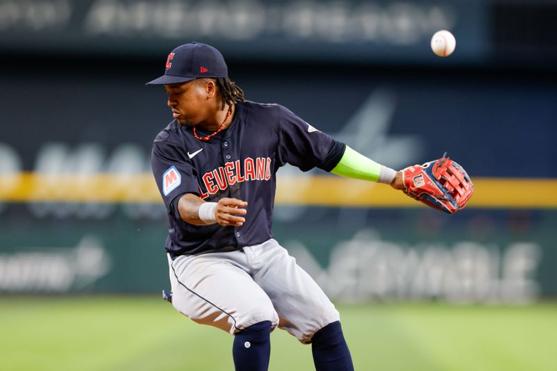 May 15, 2024; Arlington, Texas, USA; Cleveland Guardians third base Jose Ramírez (11) mishandles a hard ground ball during the fourth inning against the Texas Rangers at Globe Life Field. Mandatory Credit: Andrew Dieb-USA TODAY Sports