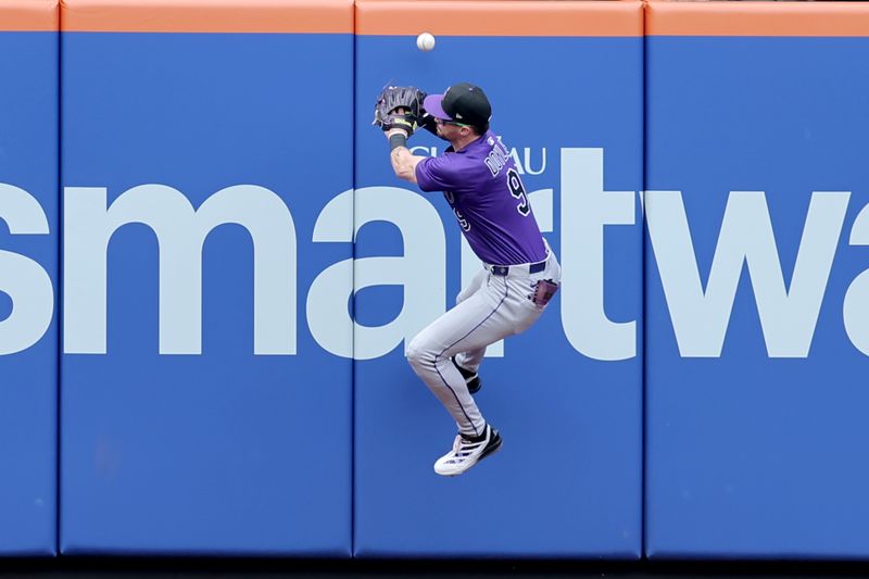 May 31, 2025; New York City, New York, USA; Colorado Rockies center fielder Brenton Doyle (9) can't catch a three run triple by New York Mets third baseman Brett Baty (not pictured) during the first inning at Citi Field. Mandatory Credit: Brad Penner-Imagn Images