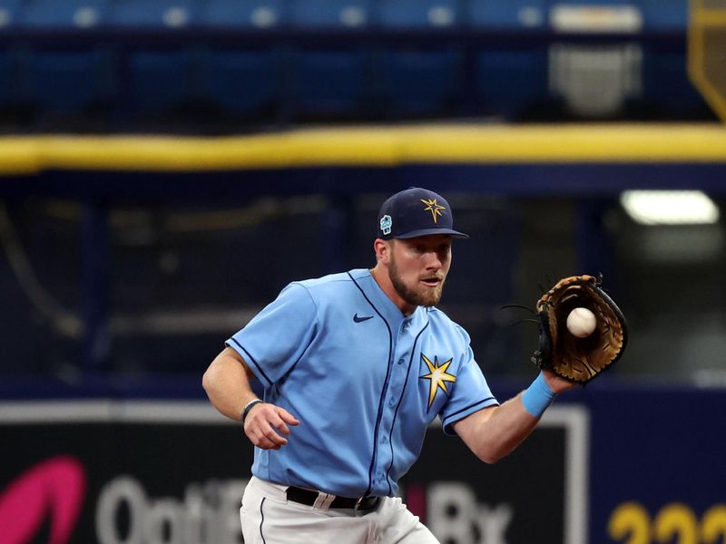 Mar 19, 2023; St. Petersburg, Florida, USA; Tampa Bay Rays right fielder Luke Raley (55) forces out during the first inning against the Toronto Blue Jays at Tropicana Field. Mandatory Credit: Kim Klement-USA TODAY Sports