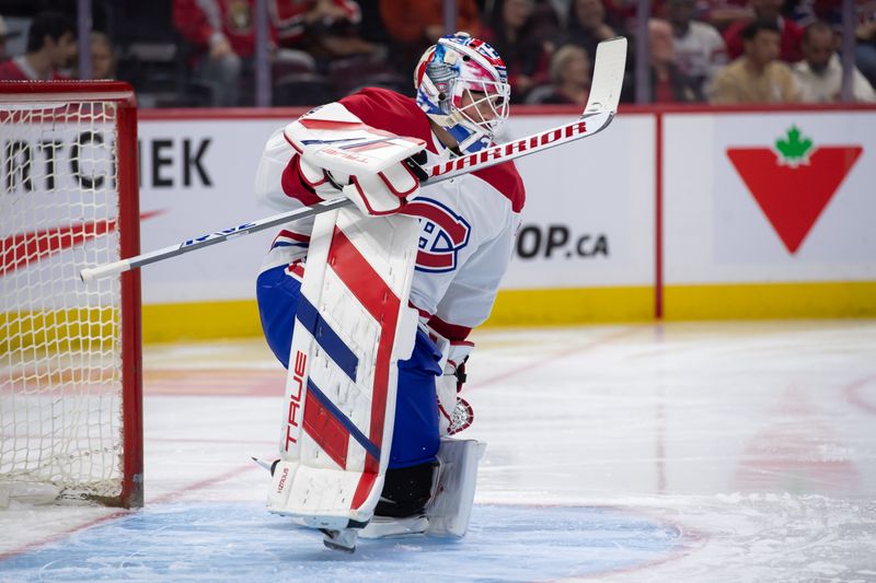 Oct 5, 2024; Ottawa, Ontario, CAN; Montreal Canadiens goalie Sam Montembeault (35) stretches prior to the start of the first period against the Ottawa Senators at the Canadian Tire Centre. Mandatory Credit: Marc DesRosiers-Imagn Images