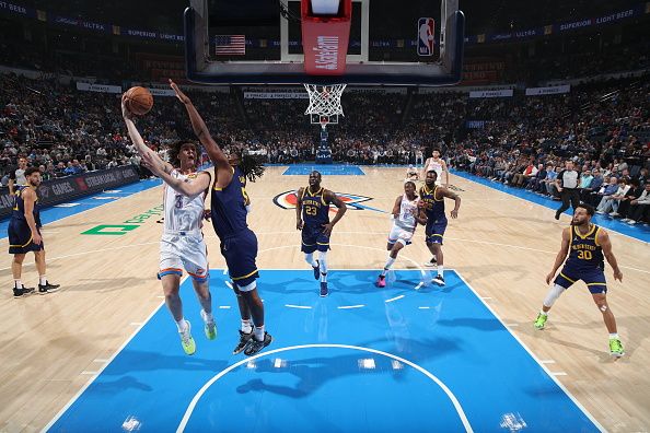 OKLAHOMA CITY, OK - DECEMBER 8: Josh Giddey #3 of the Oklahoma City Thunder drives to the basket during the game against the Golden State Warriors on December 8, 2023 at Paycom Arena in Oklahoma City, Oklahoma. NOTE TO USER: User expressly acknowledges and agrees that, by downloading and or using this photograph, User is consenting to the terms and conditions of the Getty Images License Agreement. Mandatory Copyright Notice: Copyright 2023 NBAE (Photo by Zach Beeker/NBAE via Getty Images)