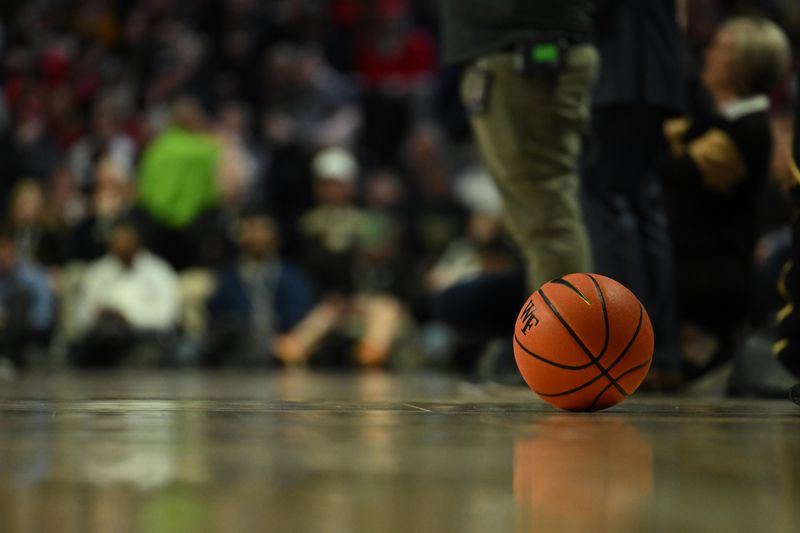 Jan 28, 2023; Winston-Salem, North Carolina, USA;  The game ball sits on the court during a timeout in the first half of the game between the North Carolina State Wolfpack and the Wake Forest Demon Deacons at Lawrence Joel Veterans Memorial Coliseum. Mandatory Credit: William Howard-USA TODAY Sports