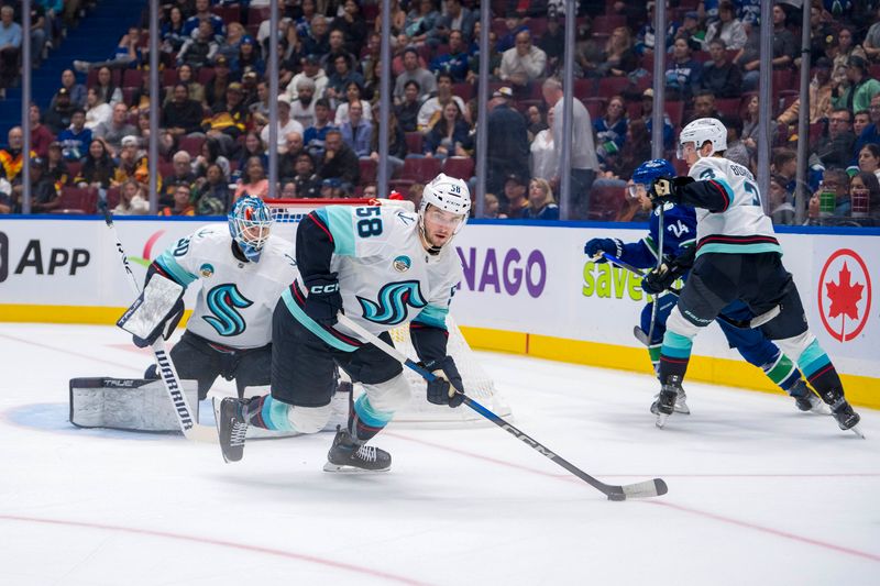 Sep 24, 2024; Vancouver, British Columbia, CAN;  Seattle Kraken forward Jani Nyman (58) handles the puck against the Vancouver Canucks during the third period at Rogers Arena. Mandatory Credit: Bob Frid-Imagn Images