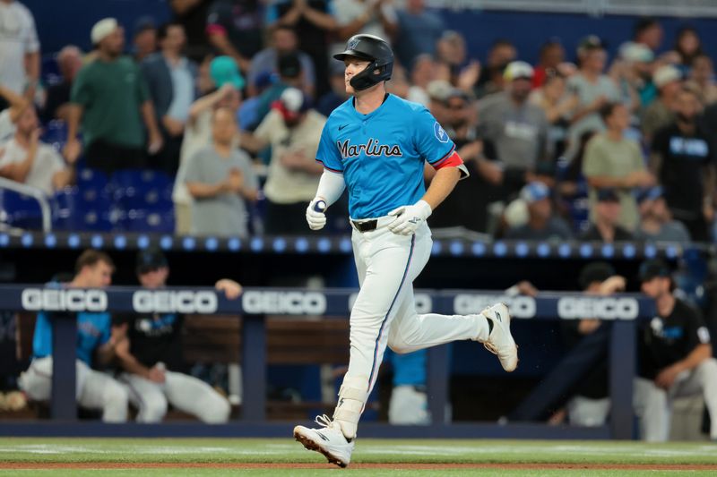 Aug 24, 2025; Miami, Florida, USA; Miami Marlins first baseman Eric Wagaman (33) circles the bases after hitting a solo home run against the Toronto Blue Jays during the third inning at loanDepot Park. Mandatory Credit: Sam Navarro-Imagn Images