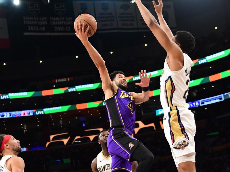 LOS ANGELES, CA - FEBRUARY 9:  Skylar Mays #4 of the Los Angeles Lakers drives to the basket during the game against the New Orleans Pelicans on February 9, 2024 at Crypto.Com Arena in Los Angeles, California. NOTE TO USER: User expressly acknowledges and agrees that, by downloading and/or using this Photograph, user is consenting to the terms and conditions of the Getty Images License Agreement. Mandatory Copyright Notice: Copyright 2024 NBAE (Photo by Adam Pantozzi/NBAE via Getty Images)