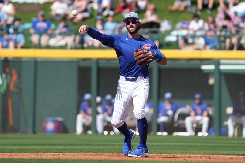 Mar 1, 2026; Mesa, Arizona, USA; Chicago Cubs shortstop Dansby Swanson (7) makes the play for an out against the Chicago White Sox in the second inning at Sloan Park. Mandatory Credit: Rick Scuteri-Imagn Images