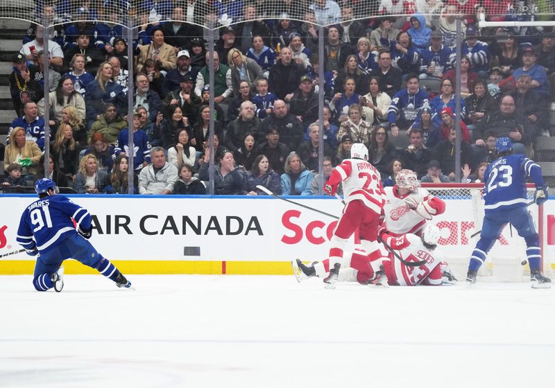 Apr 13, 2024; Toronto, Ontario, CAN; Toronto Maple Leafs center John Tavares (91) scores a goal against the Detroit Red Wings during the second period at Scotiabank Arena. Mandatory Credit: Nick Turchiaro-USA TODAY Sports